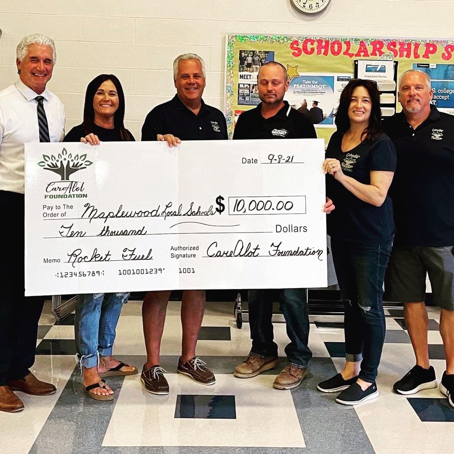 A ten thousand dollar CareALot Foundation check presented to Maplewood Local Schools
